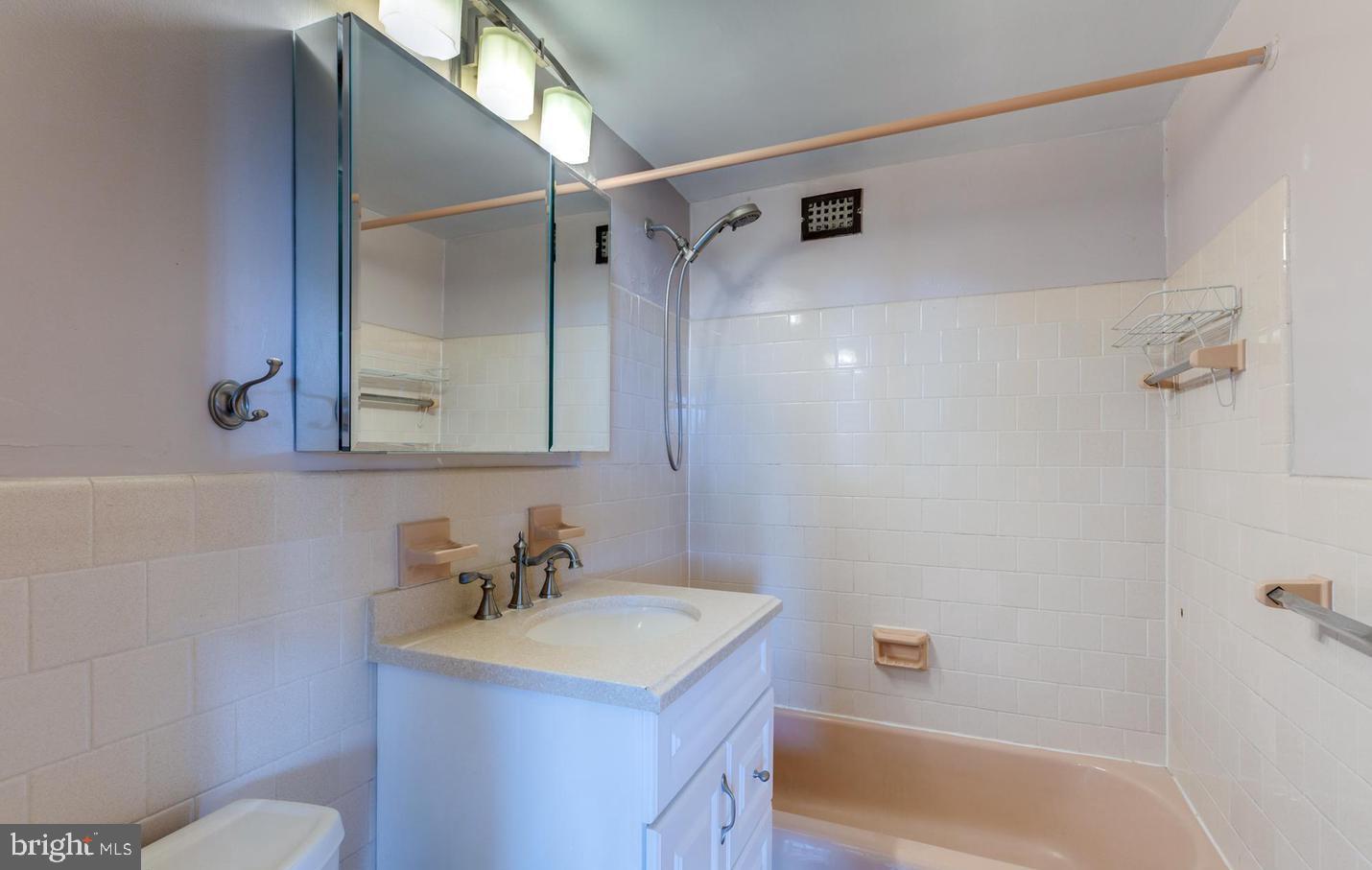 4401 Cherry Hill Road, Unit 66 Arlington, VA 22207 - Photo 16 of 29 a bathroom with a sink toilet vanity and shower