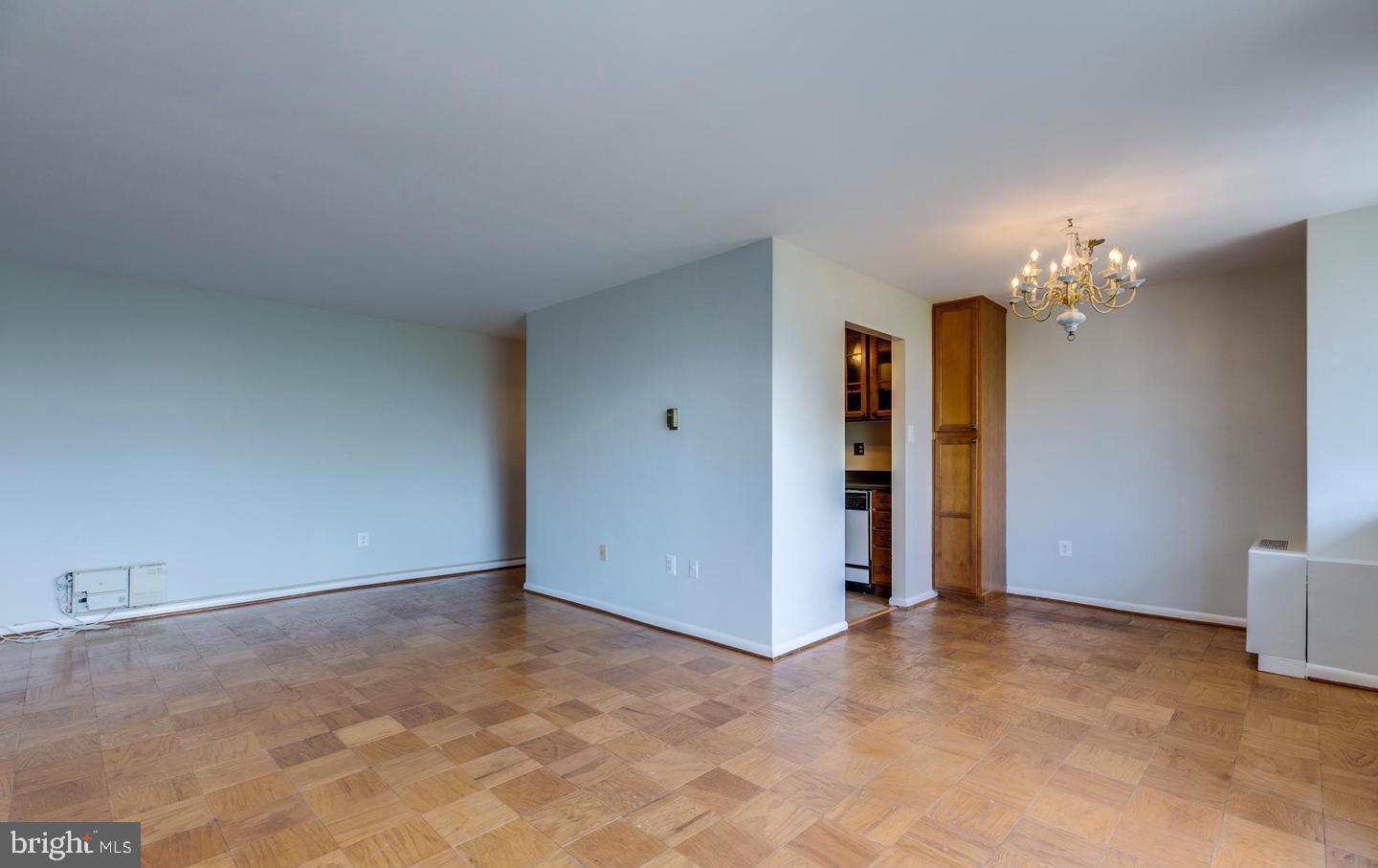 4401 Cherry Hill Road, Unit 66 Arlington, VA 22207 - Photo 3 of 29 a view of an empty room with a chandelier fan