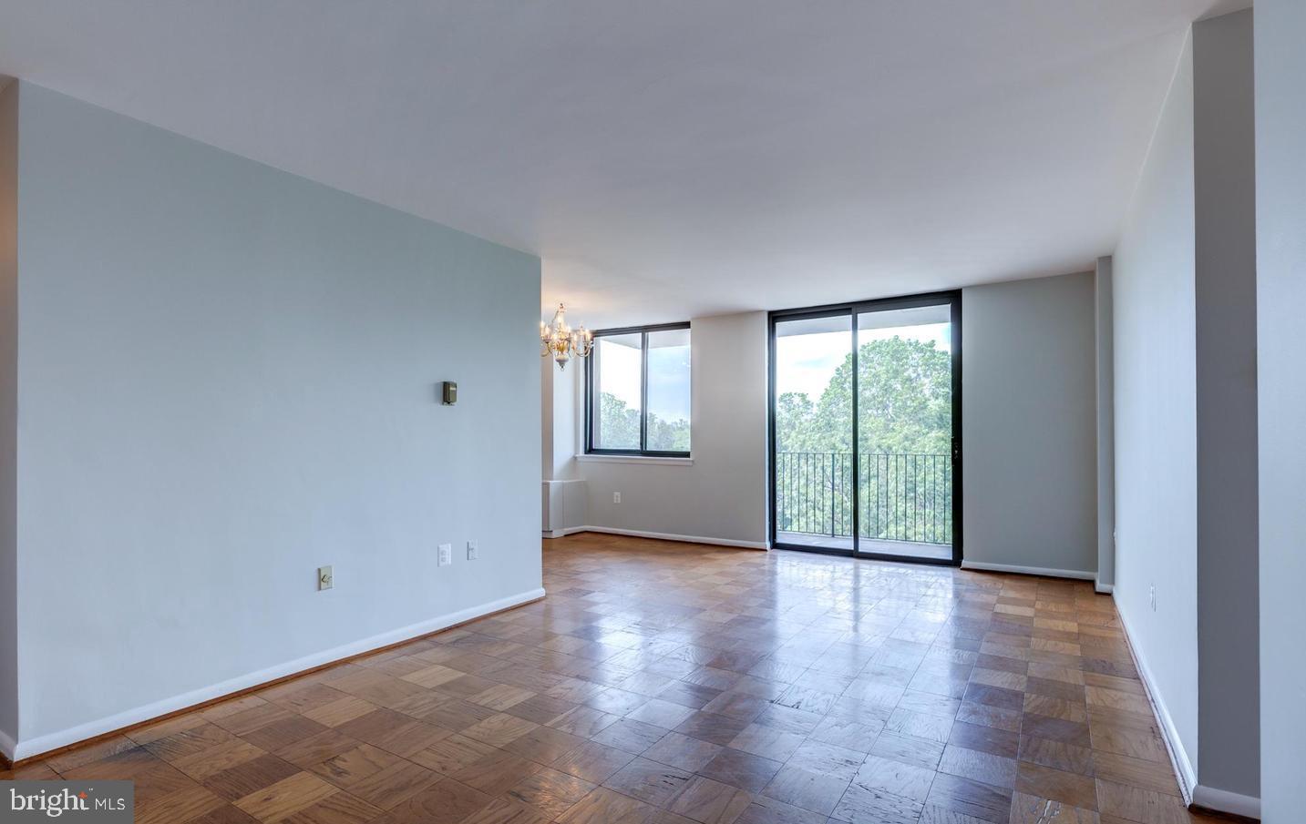 4401 Cherry Hill Road, Unit 66 Arlington, VA 22207 - Photo 4 of 29 a view of an empty room with glass door and balcony
