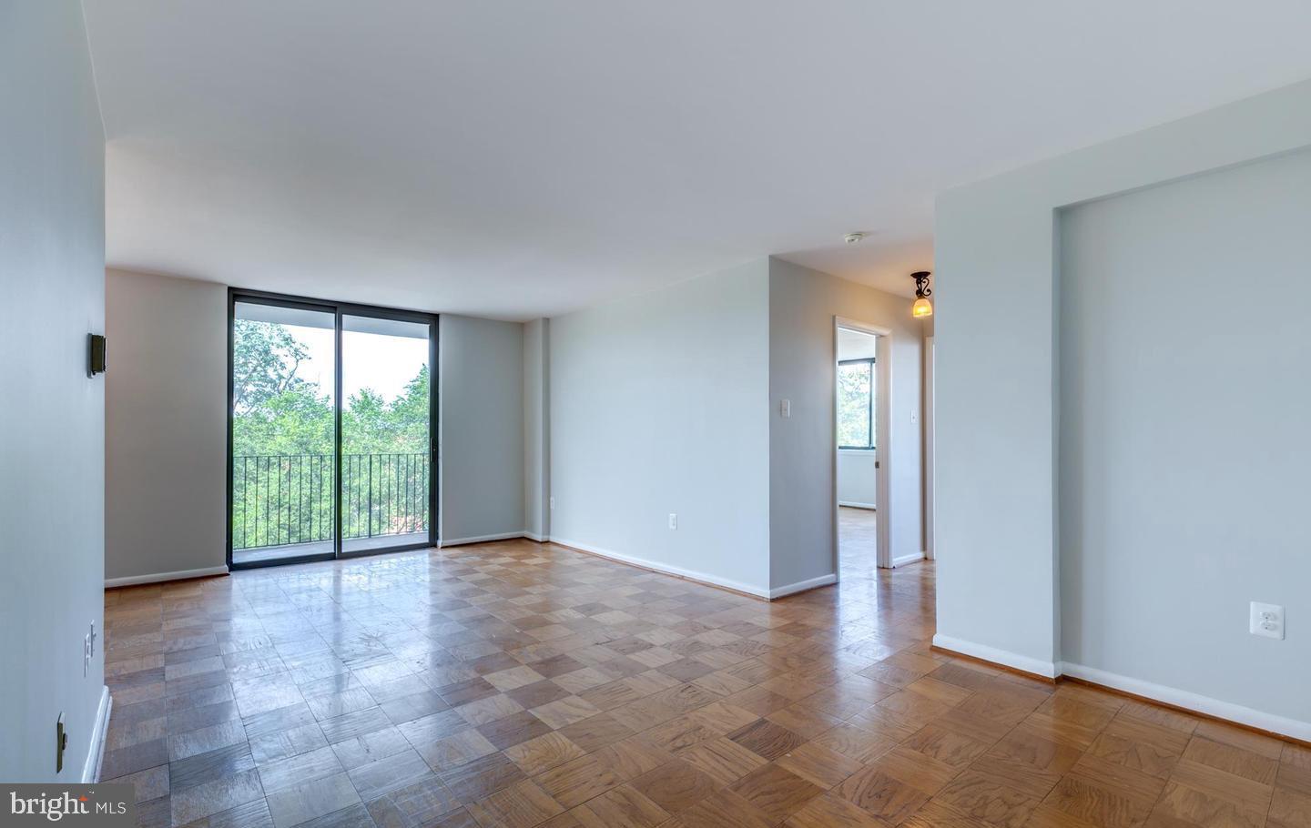 4401 Cherry Hill Road, Unit 66 Arlington, VA 22207 - Photo 5 of 29 wooden floor in an empty room with a window
