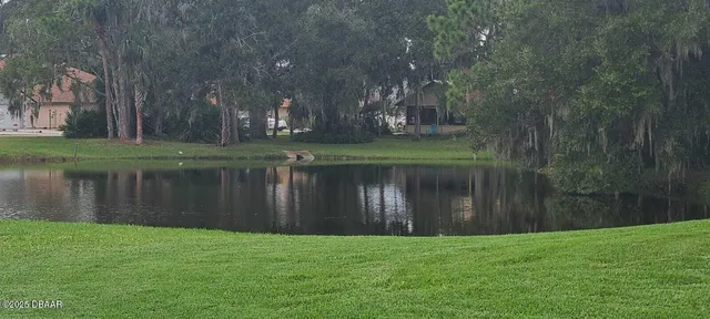 a bathroom with a granite countertop sink toilet a mirror and shower