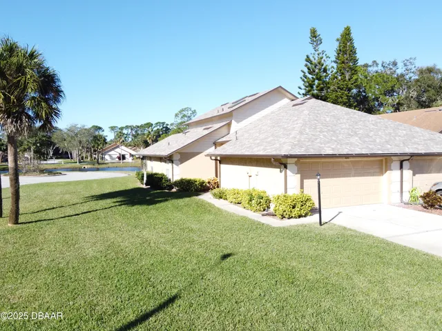 a view of a swimming pool with a yard