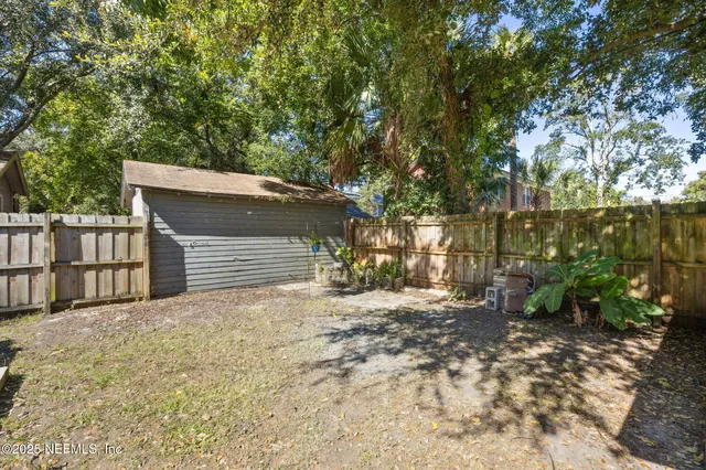 a view of a backyard of the house