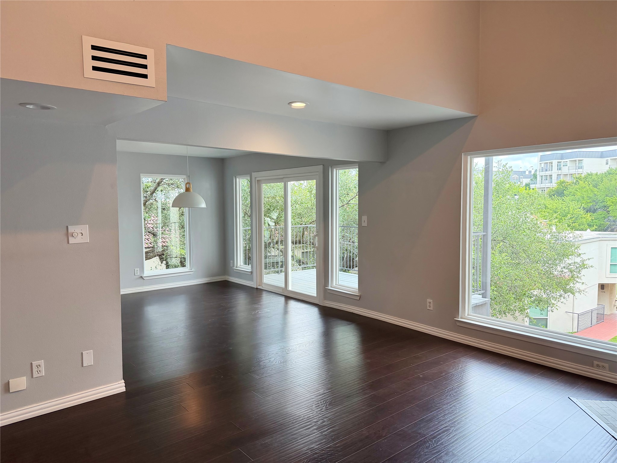 2918 Ranch Road 620 North, Unit C120 Austin, TX 78734 - Photo 5 of 34 Rich hardwood floors complement this inviting living space with generous natural light and a private balcony.