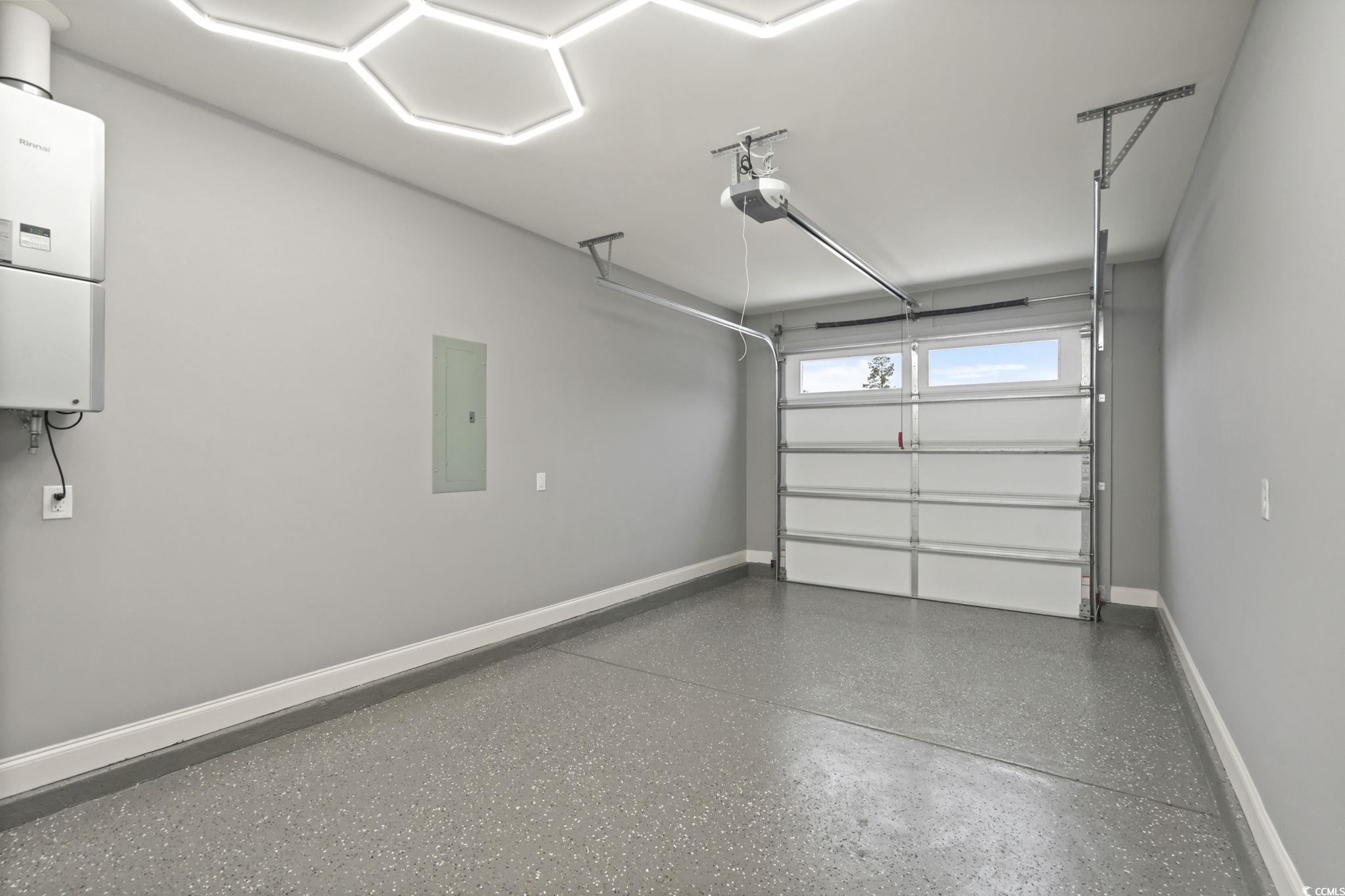 148 Arbor Ridge Circle Conway, SC 29526 - Photo 2 of 37 Garage with water heater, electric panel, and a garage door opener