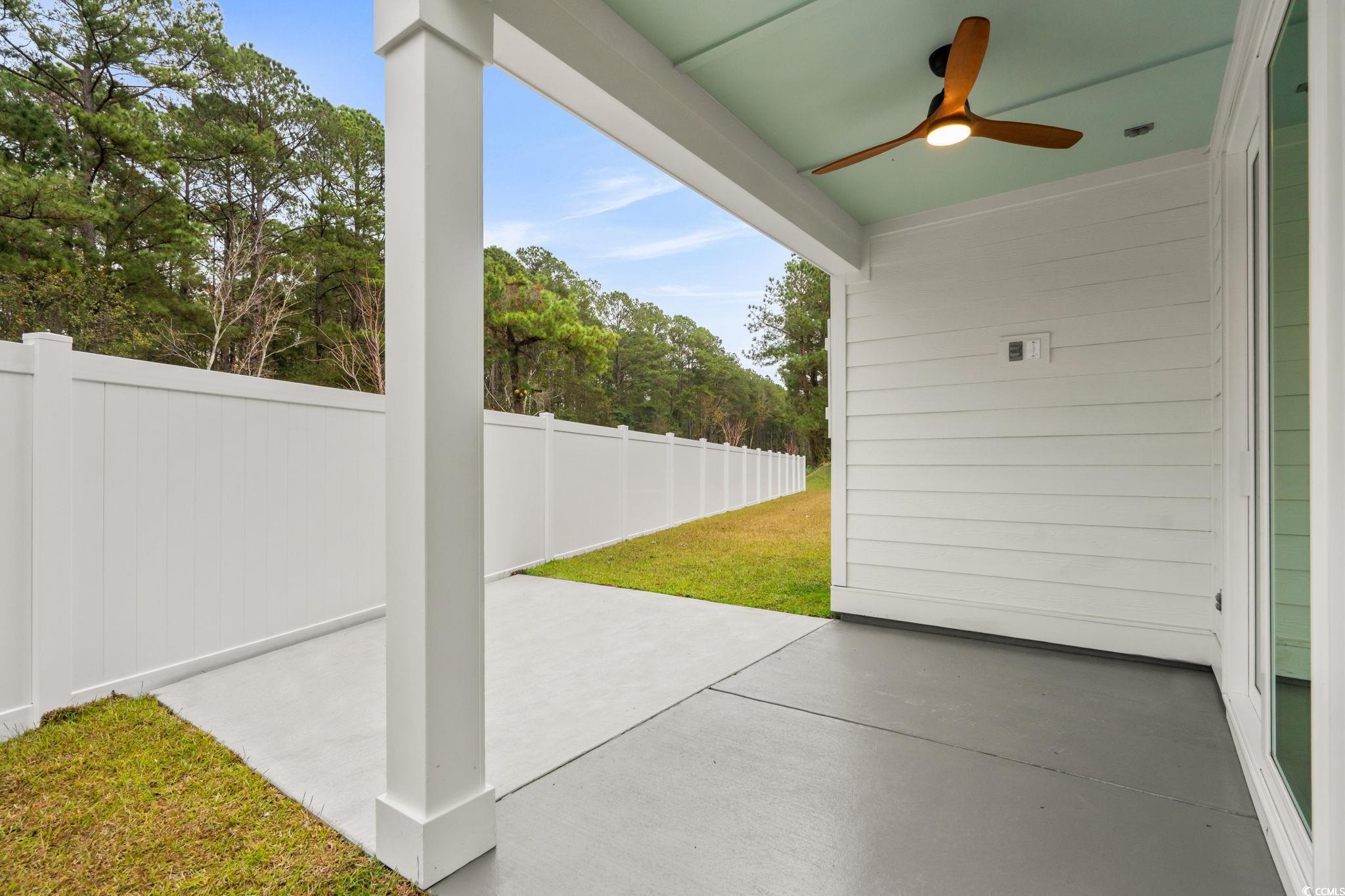 148 Arbor Ridge Circle Conway, SC 29526 - Photo 21 of 37 View of patio with a ceiling fan and view of scattered trees