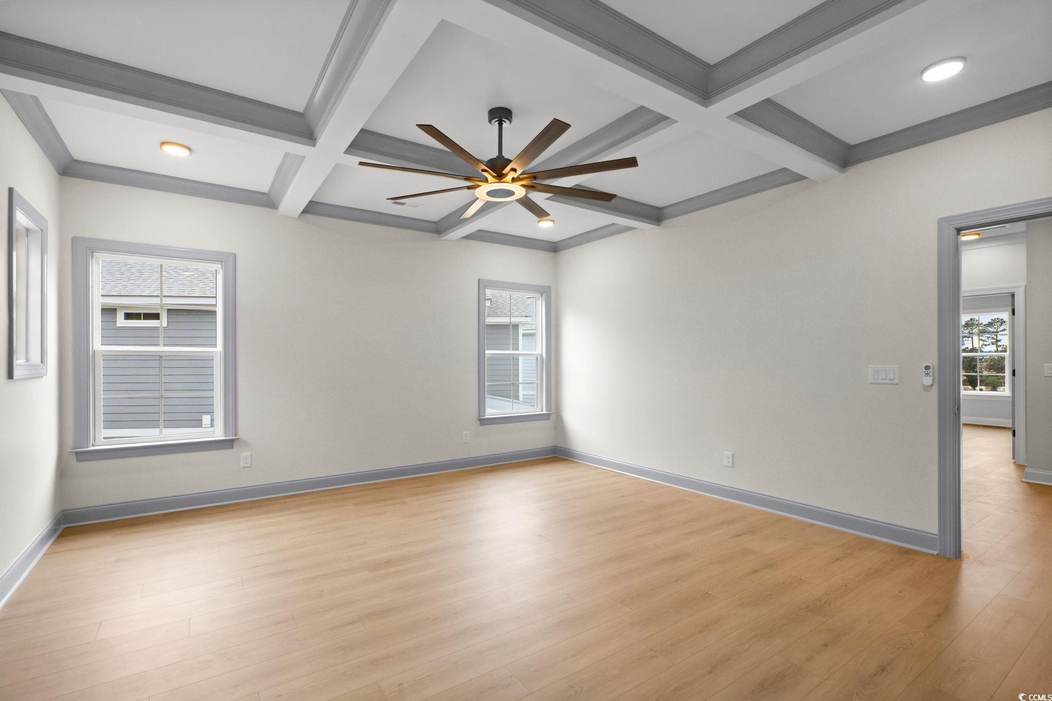 148 Arbor Ridge Circle Conway, SC 29526 - Photo 26 of 37 Spare room with light wood-style floors, coffered ceiling, beam ceiling, ceiling fan, and ornamental molding