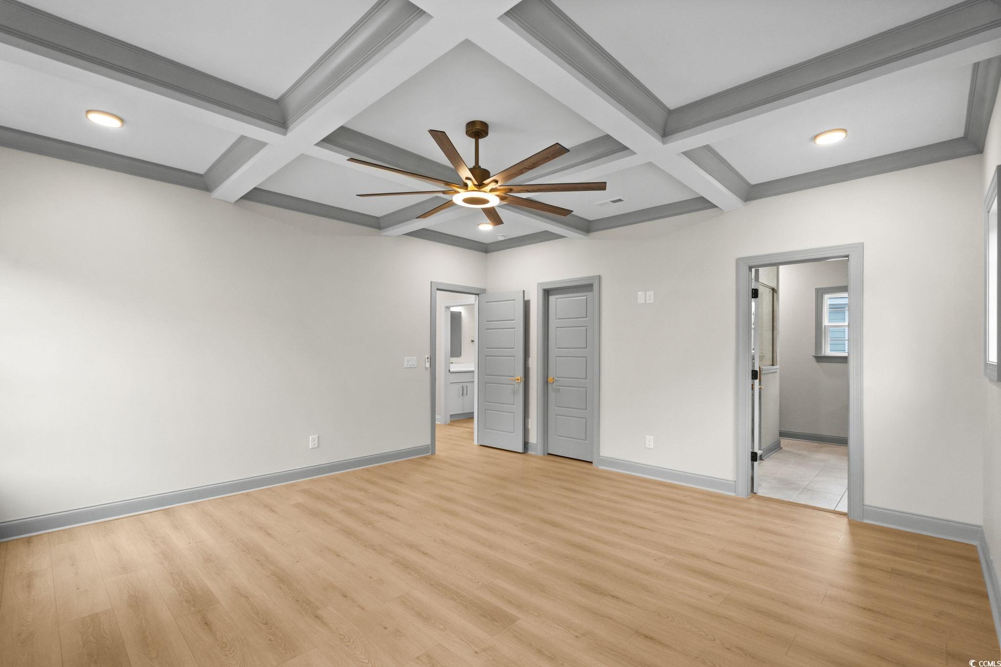 148 Arbor Ridge Circle Conway, SC 29526 - Photo 27 of 37 Unfurnished bedroom with coffered ceiling, light wood-type flooring, beamed ceiling, ensuite bathroom, and ceiling fan