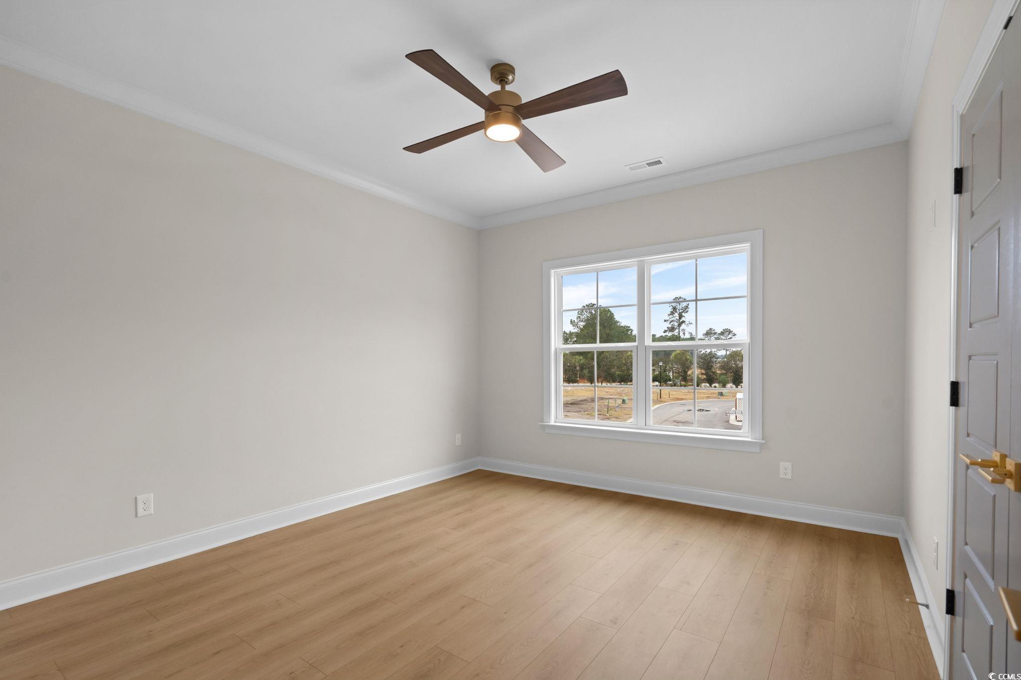 148 Arbor Ridge Circle Conway, SC 29526 - Photo 32 of 37 Empty room with ornamental molding, light wood-style floors, and ceiling fan