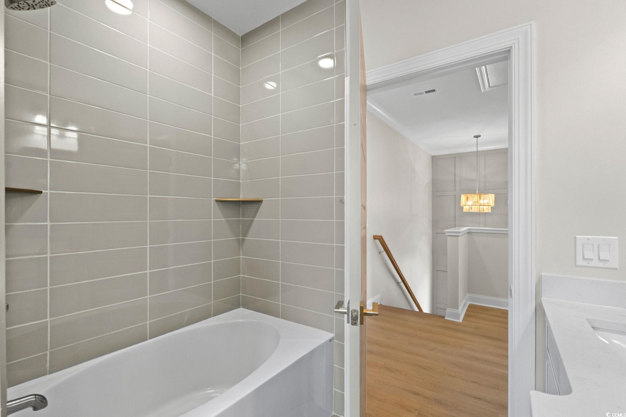 148 Arbor Ridge Circle Conway, SC 29526 - Photo 34 of 37 Full bath featuring vanity, wood finished floors, and shower / bathtub combination