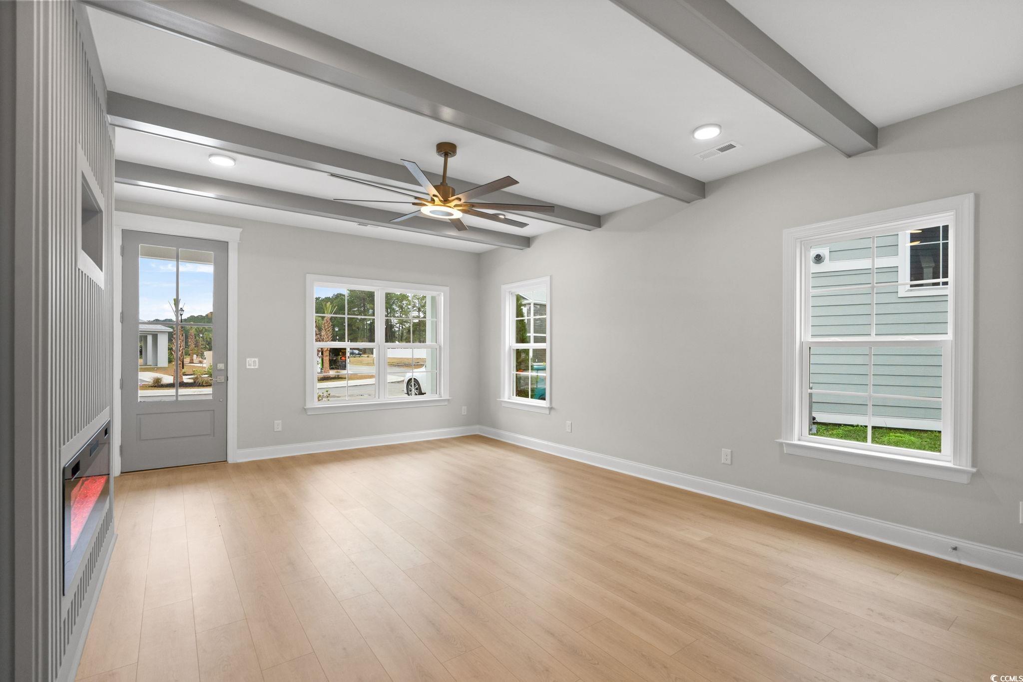 148 Arbor Ridge Circle Conway, SC 29526 - Photo 7 of 37 Spare room featuring a ceiling fan, light wood finished floors, beamed ceiling, and recessed lighting