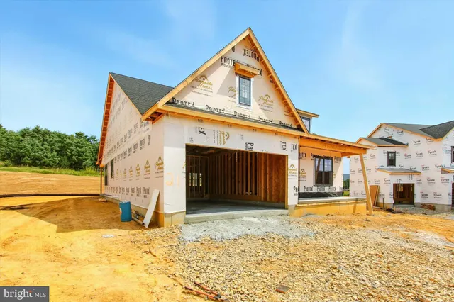 a spacious bedroom with a bed and glass door