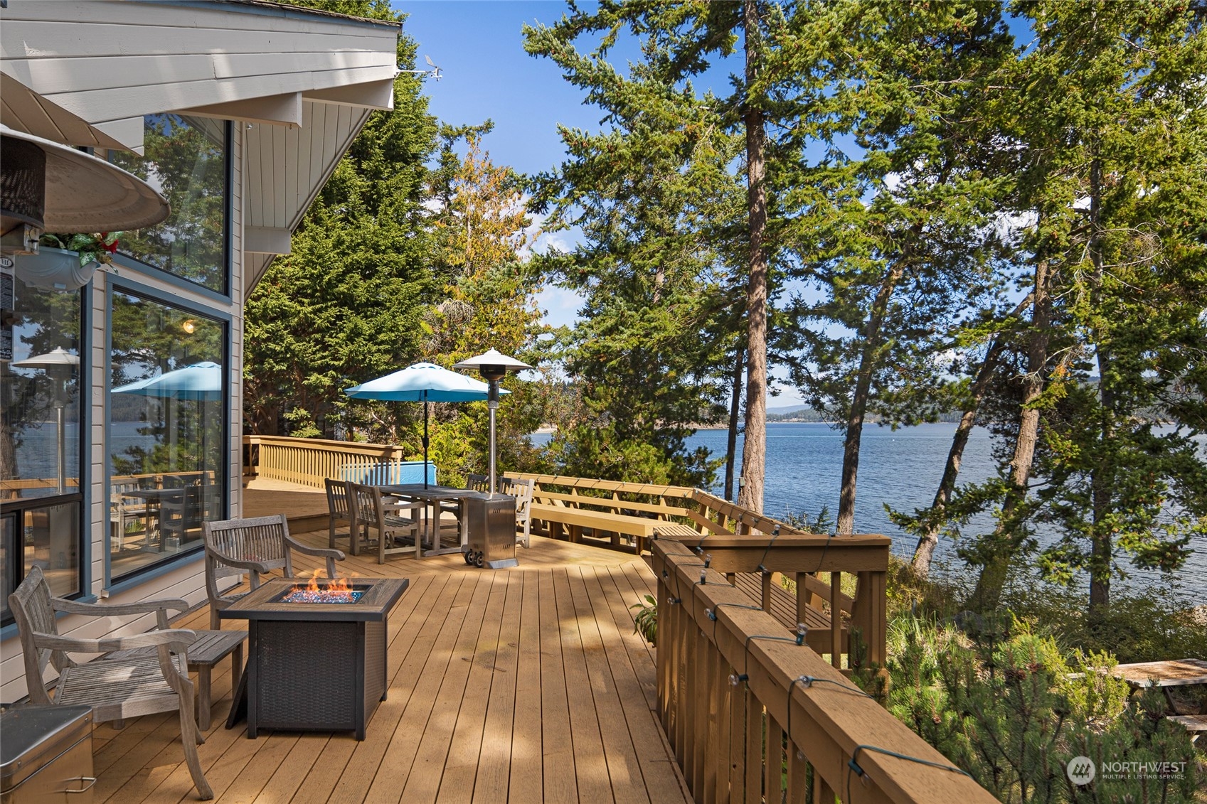 1045 Port Stanley Road Lopez Island, WA 98261 - Photo 11 of 40 a view of a patio with chairs and a potted plant