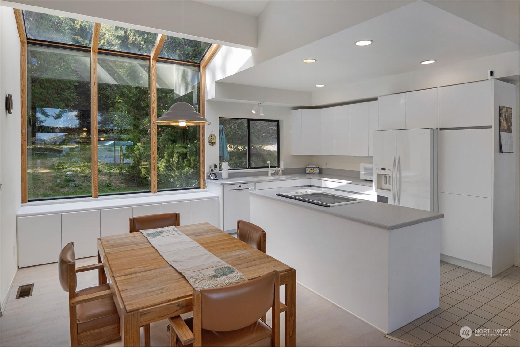 1045 Port Stanley Road Lopez Island, WA 98261 - Photo 15 of 40 a kitchen with stainless steel appliances granite countertop a sink and a refrigerator