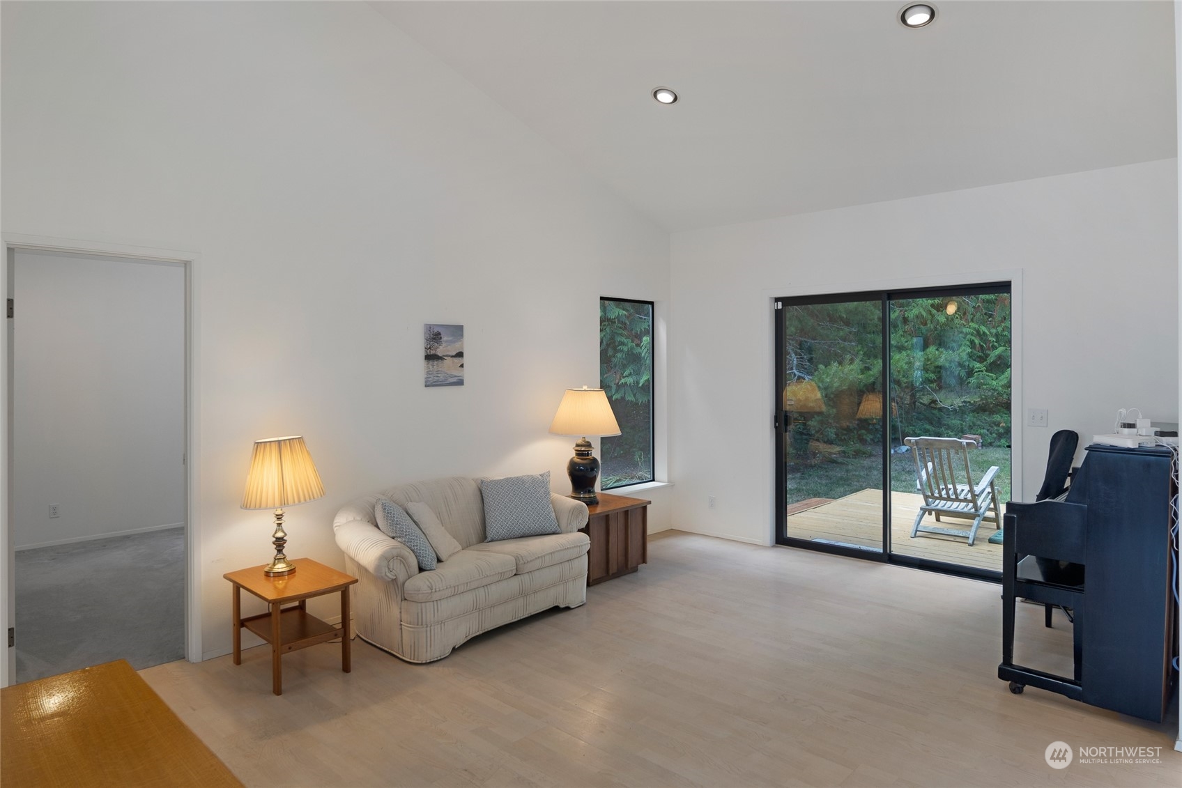 1045 Port Stanley Road Lopez Island, WA 98261 - Photo 17 of 40 a living room with furniture and a lamp