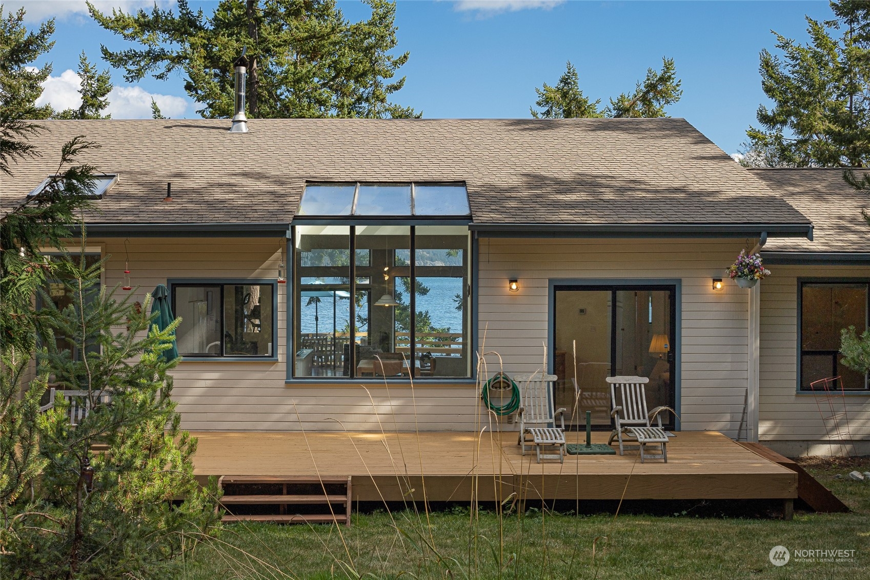 1045 Port Stanley Road Lopez Island, WA 98261 - Photo 18 of 40 a view of a dinning table and chairs in patio