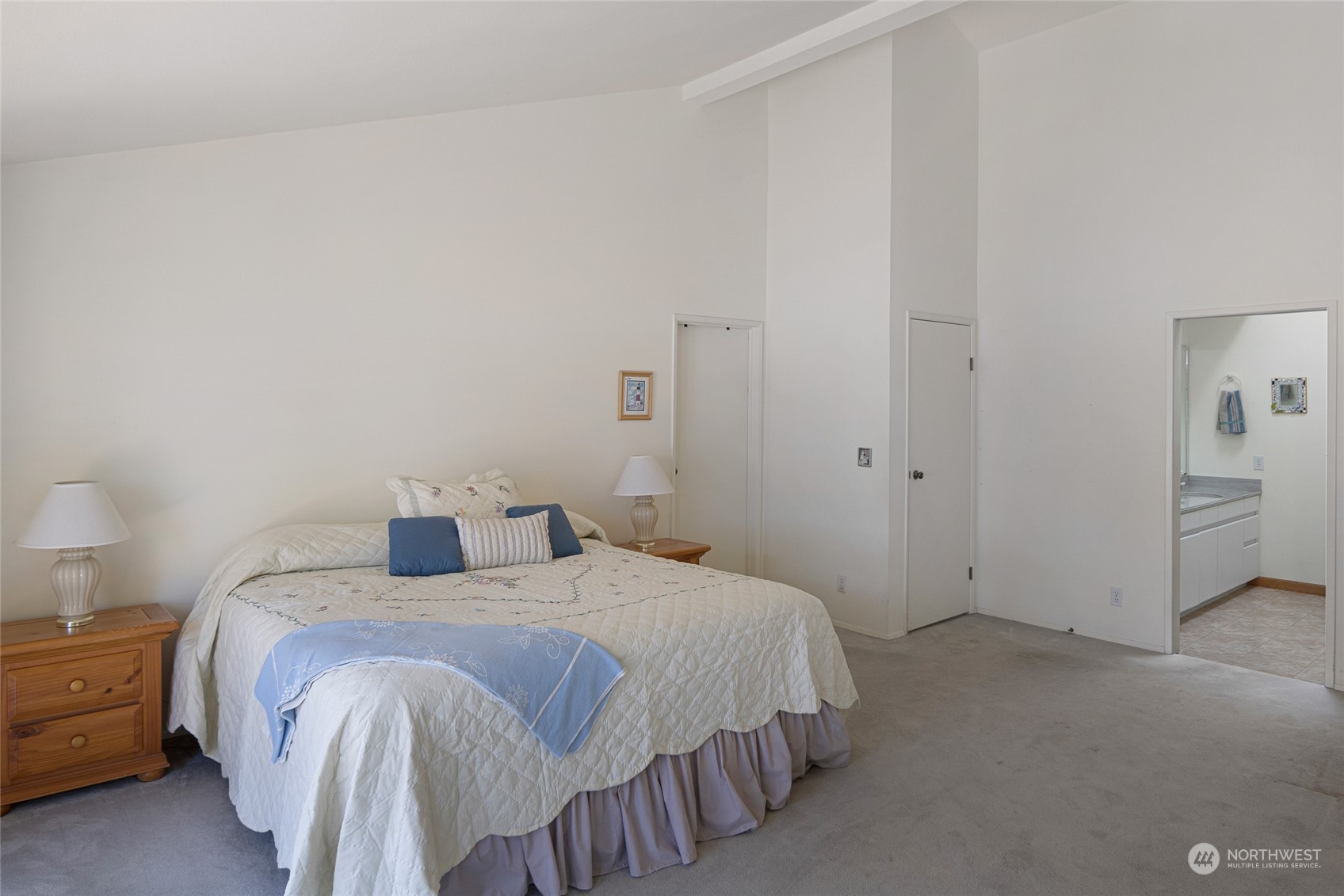 1045 Port Stanley Road Lopez Island, WA 98261 - Photo 21 of 40 a bedroom with a bed and a table