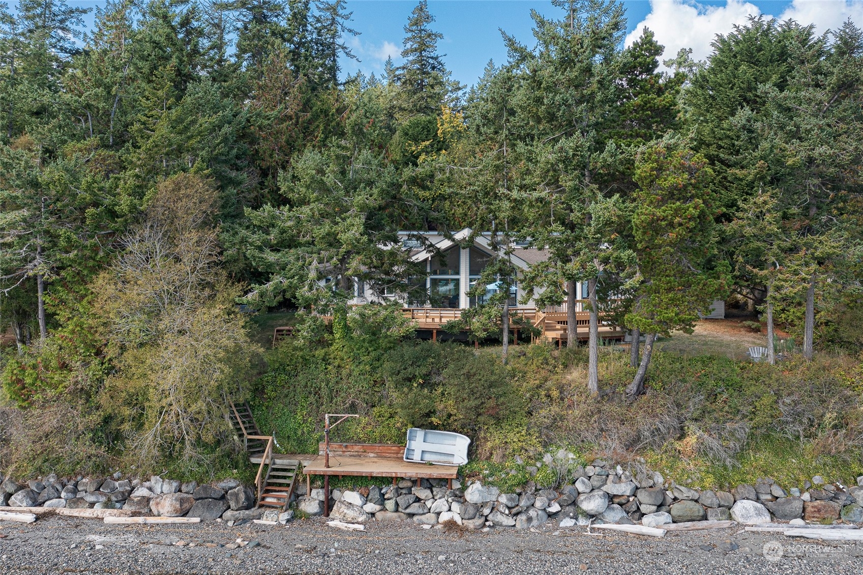 1045 Port Stanley Road Lopez Island, WA 98261 - Photo 30 of 40 a backyard of a house with table and chairs
