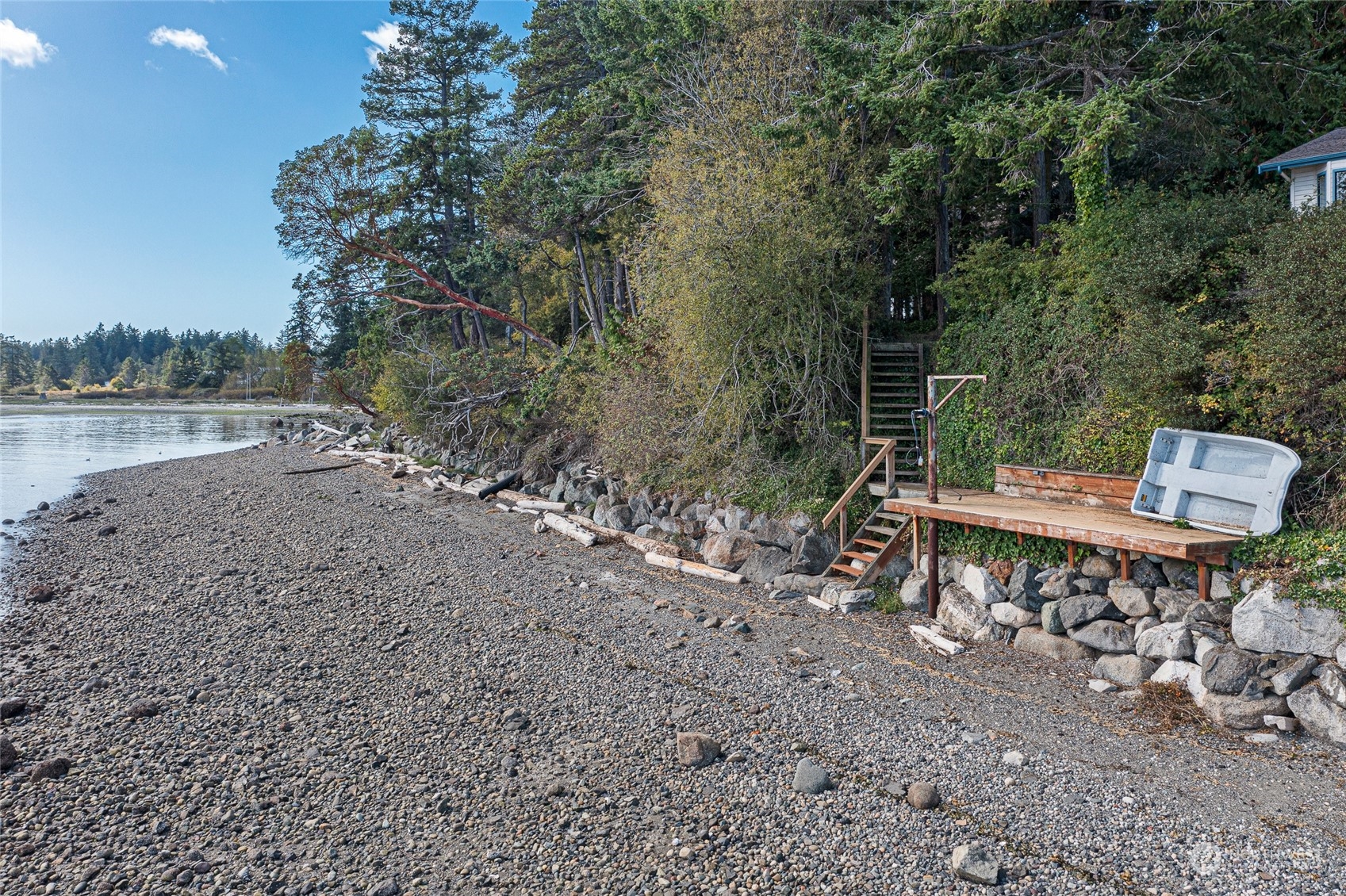 1045 Port Stanley Road Lopez Island, WA 98261 - Photo 31 of 40 a backyard of a house with table and chairs