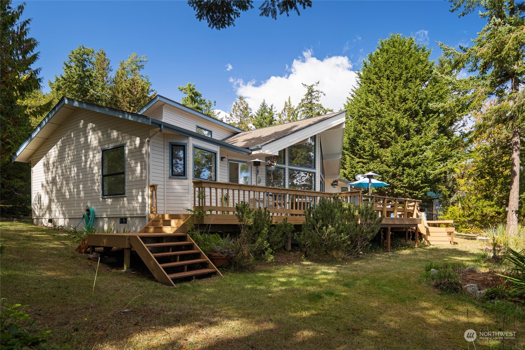 1045 Port Stanley Road Lopez Island, WA 98261 - Photo 36 of 40 a front view of a house with a yard