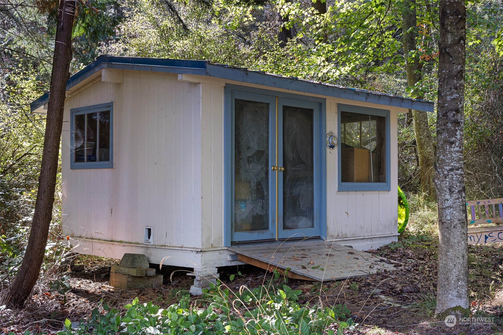 1045 Port Stanley Road Lopez Island, WA 98261 - Photo 37 of 40 a front view of a house with a yard