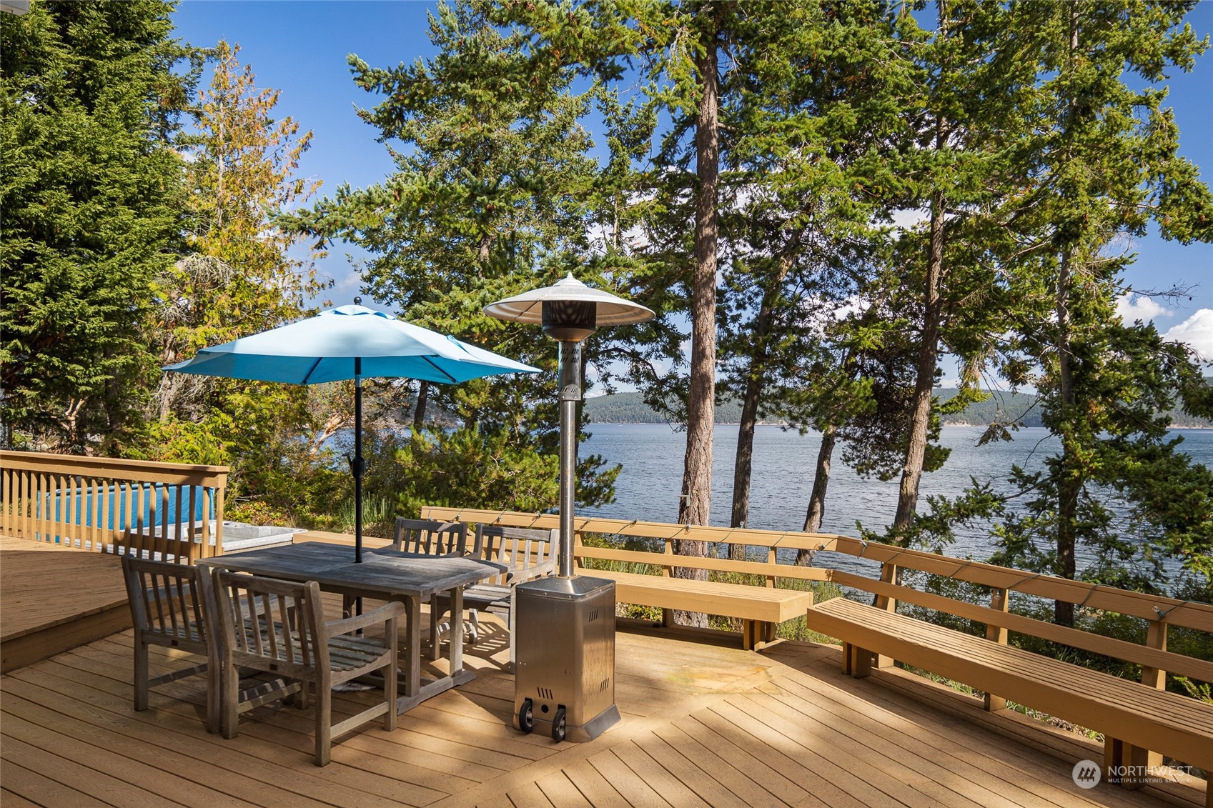 1045 Port Stanley Road Lopez Island, WA 98261 - Photo 10 of 40 an outdoor space with furniture and umbrella