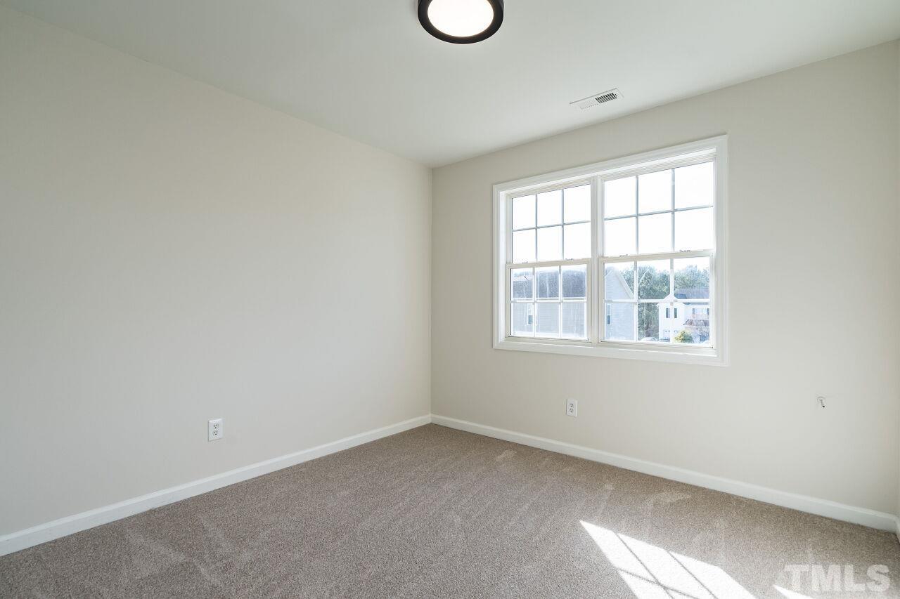 4204 Beacon Crest Way Raleigh, NC 27604 - Photo 24 of 29 an empty room with a window