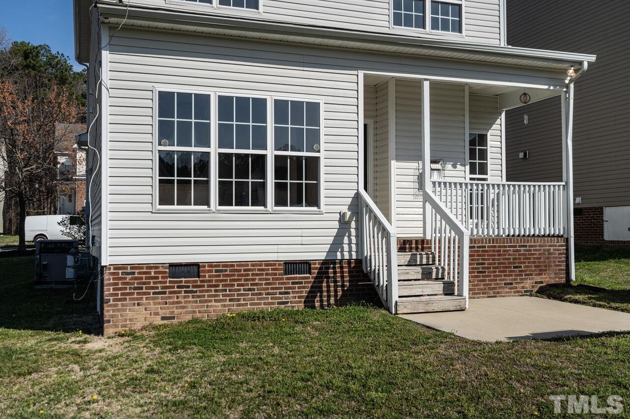 4204 Beacon Crest Way Raleigh, NC 27604 - Photo 29 of 29 a view of a house with a large window and stairs