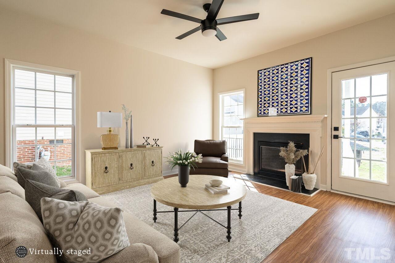 4204 Beacon Crest Way Raleigh, NC 27604 - Photo 7 of 29 a living room with furniture fireplace and window