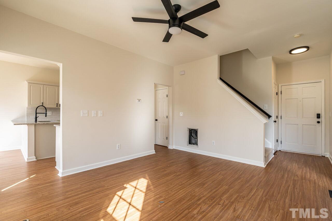 4204 Beacon Crest Way Raleigh, NC 27604 - Photo 9 of 29 a view of empty room with wooden floor and window