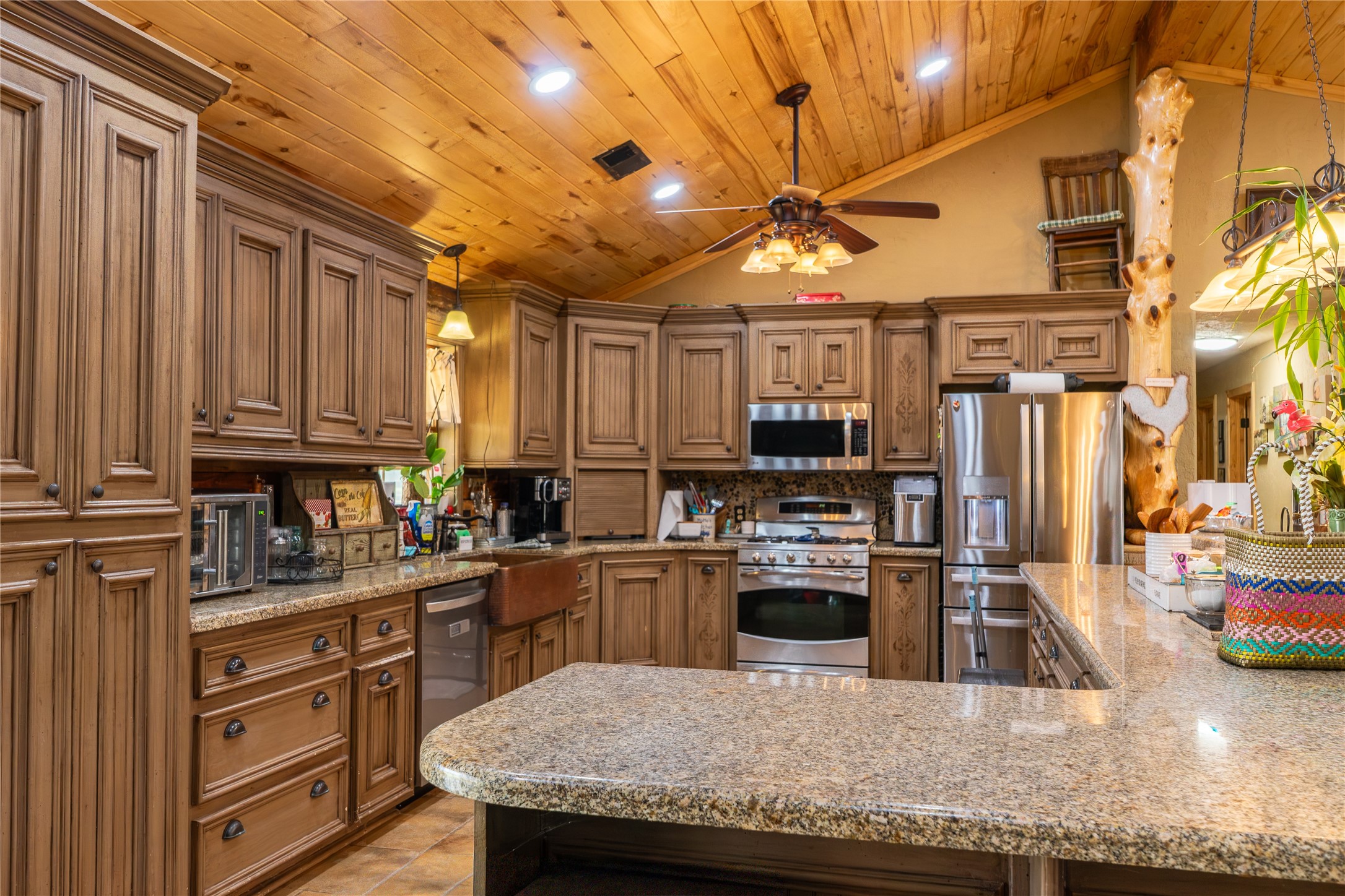 23888 Laneview Road Hempstead, TX 77445 - Photo 7 of 39 a kitchen with stainless steel appliances granite countertop a sink a stove and a refrigerator
