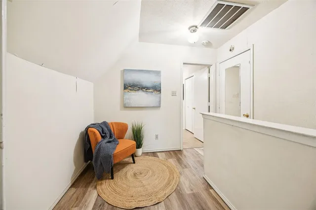 a room with furniture and wooden floor