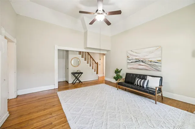 a bedroom with furniture and a rug