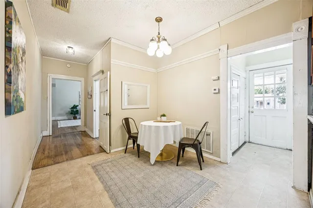 a view of a livingroom with furniture window and wooden floor