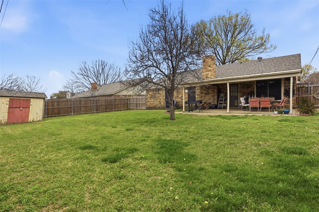 6437 High Lawn Terrace Watauga, TX 76148 - Photo 20 of 21 a front view of a house with a yard and trees