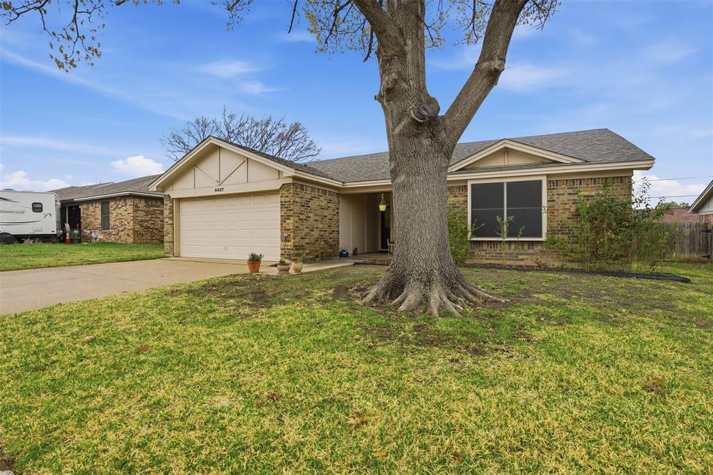 6437 High Lawn Terrace Watauga, TX 76148 - Photo 3 of 21 a front view of a house with a yard