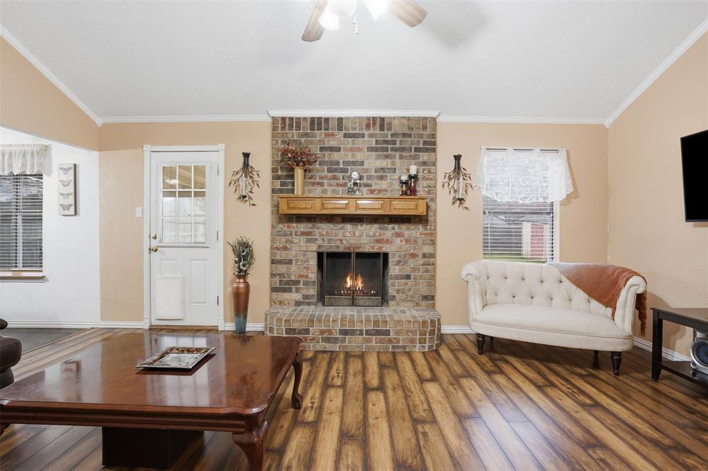 6437 High Lawn Terrace Watauga, TX 76148 - Photo 6 of 21 a living room with furniture and a fireplace