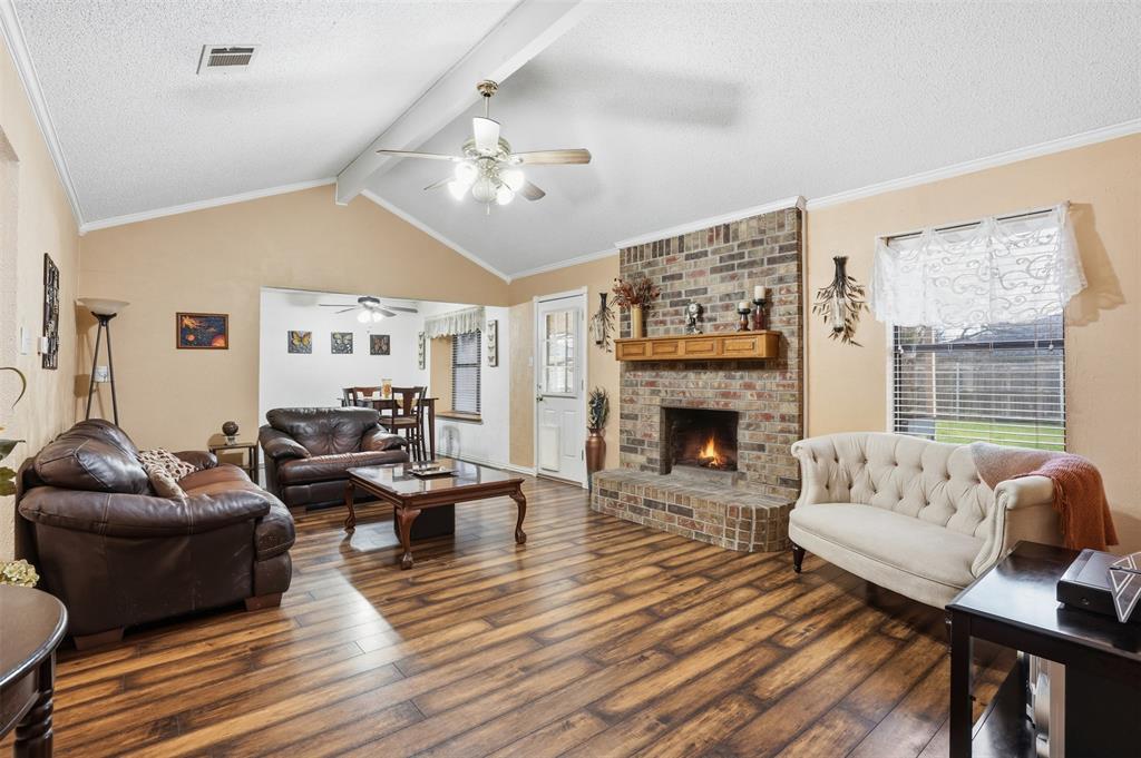 6437 High Lawn Terrace Watauga, TX 76148 - Photo 8 of 21 a living room with furniture and a fireplace