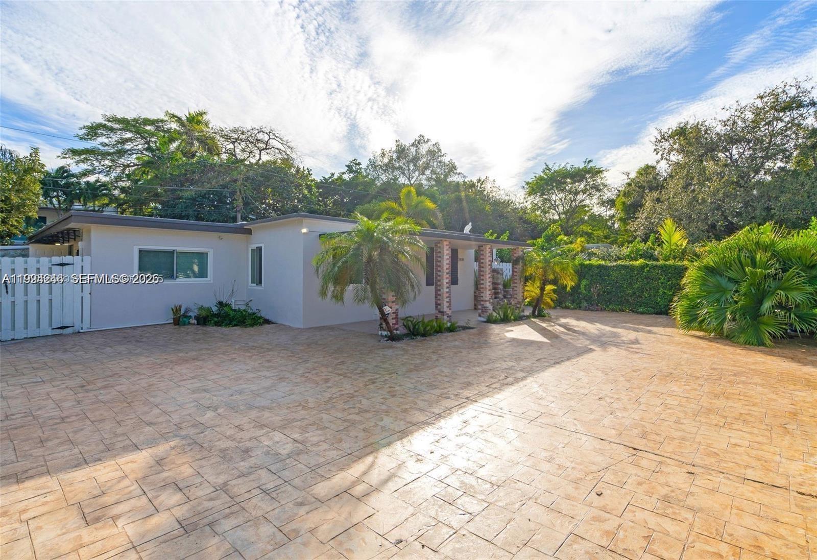 3800 Charles Terrace Miami, FL 33133 - Photo 1 of 16 a view of a house with backyard and bushes