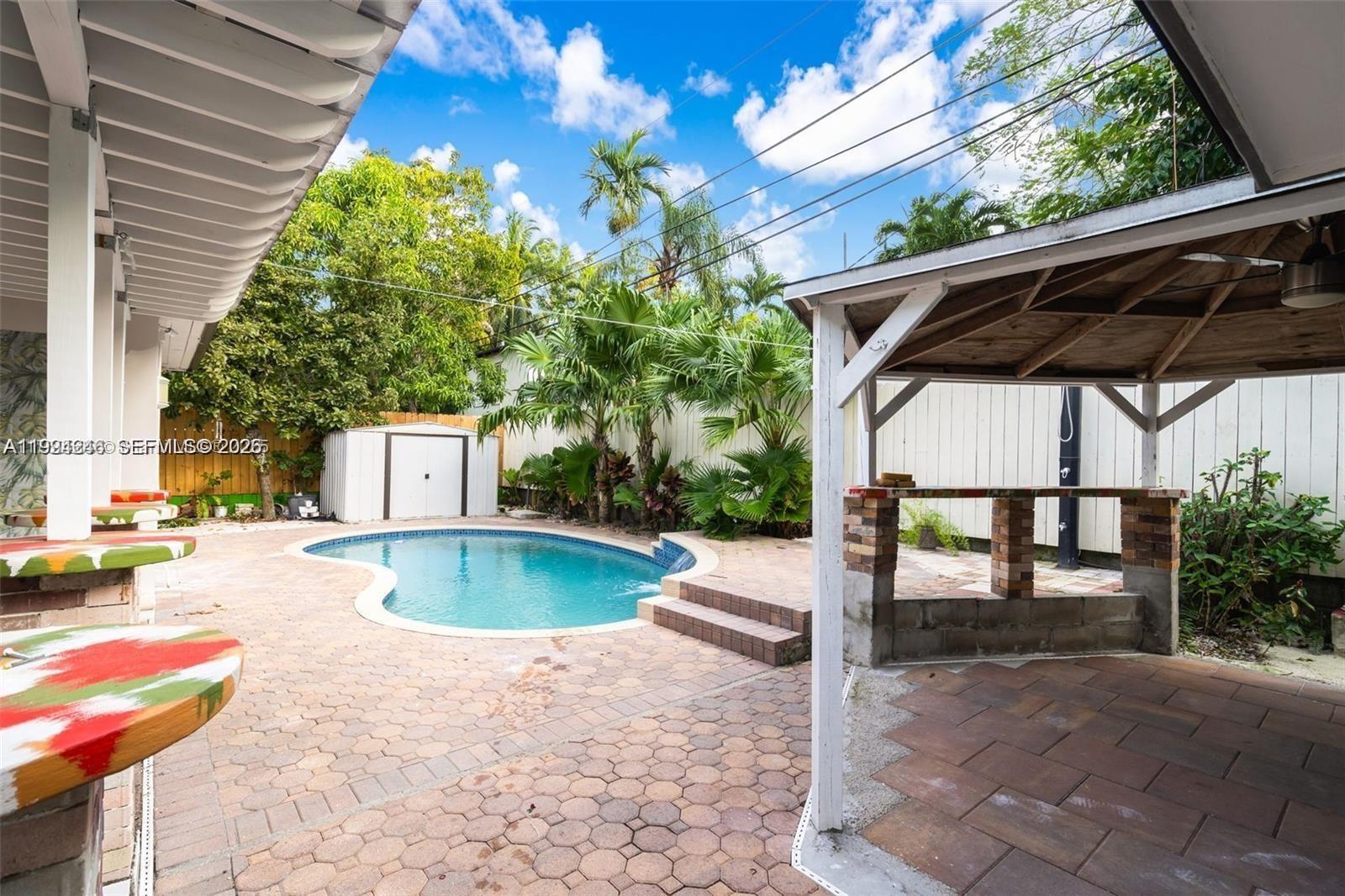 3800 Charles Terrace Miami, FL 33133 - Photo 13 of 16 a view of a swimming pool with a patio