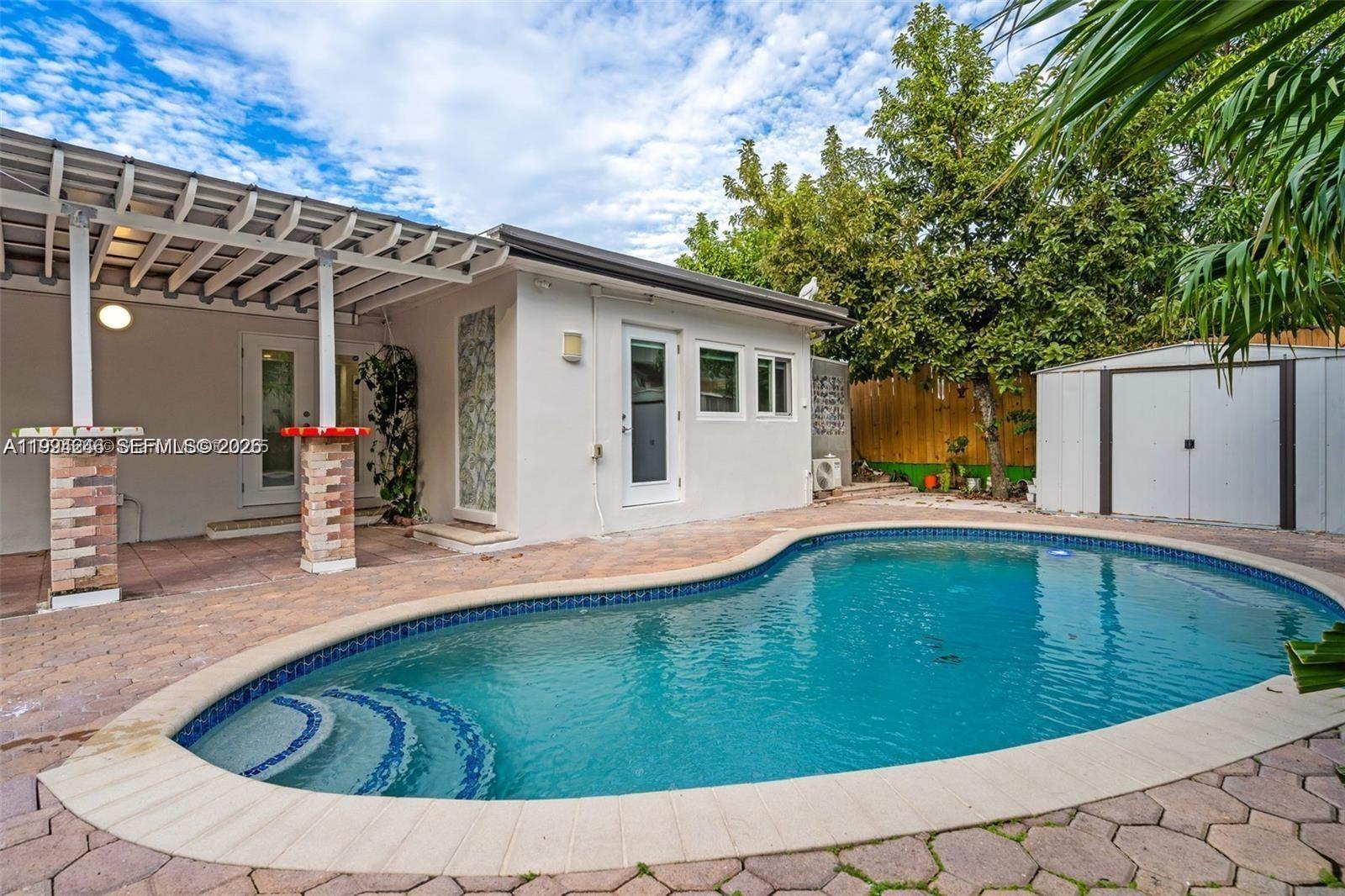 3800 Charles Terrace Miami, FL 33133 - Photo 14 of 16 a swimming pool with outdoor seating and yard