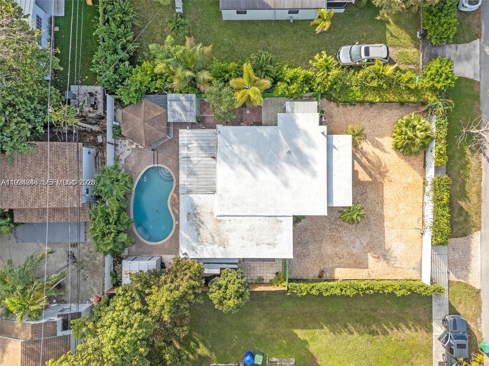 3800 Charles Terrace Miami, FL 33133 - Photo 16 of 16 a aerial view of a house with swimming pool outdoor seating and yard