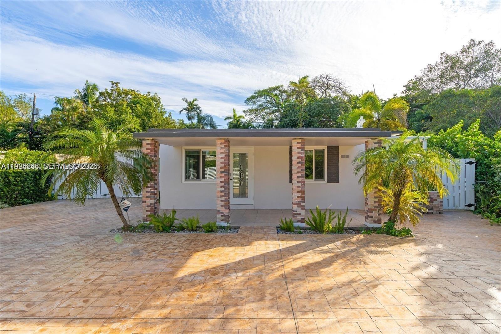 3800 Charles Terrace Miami, FL 33133 - Photo 2 of 16 a view of a house with backyard and plants