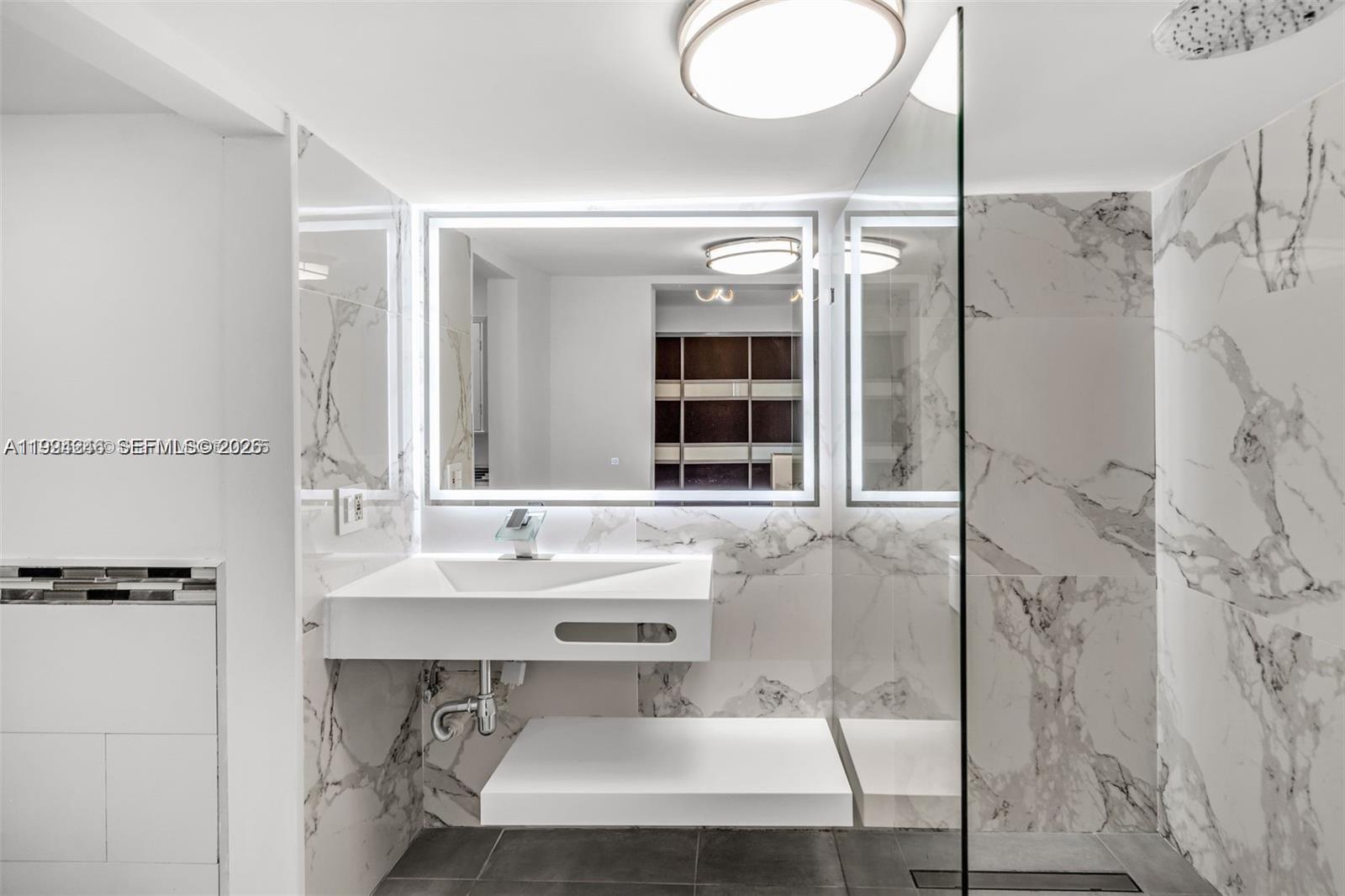 3800 Charles Terrace Miami, FL 33133 - Photo 5 of 16 a bathroom with a sink and a mirror