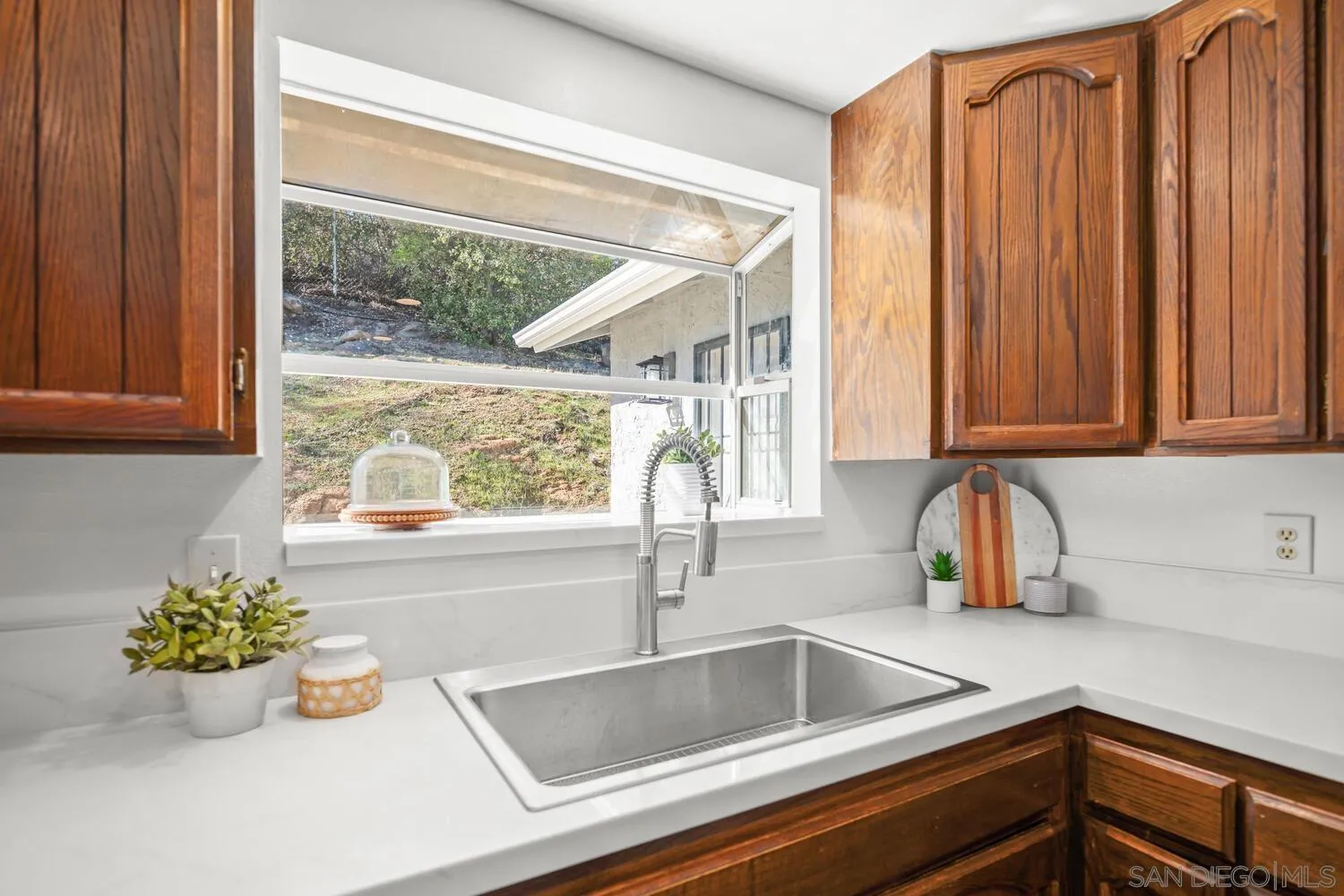 18435 Chablis Road Ramona, CA 92065 - Photo 11 of 49 a kitchen with a sink and large window