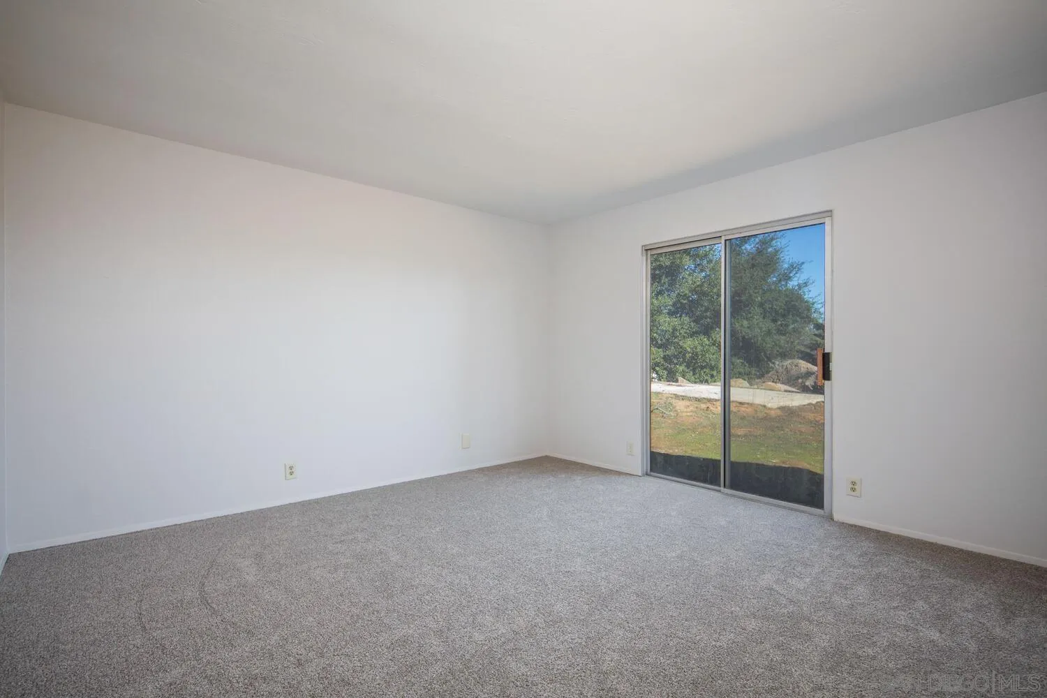 18435 Chablis Road Ramona, CA 92065 - Photo 26 of 49 an empty room with glass door