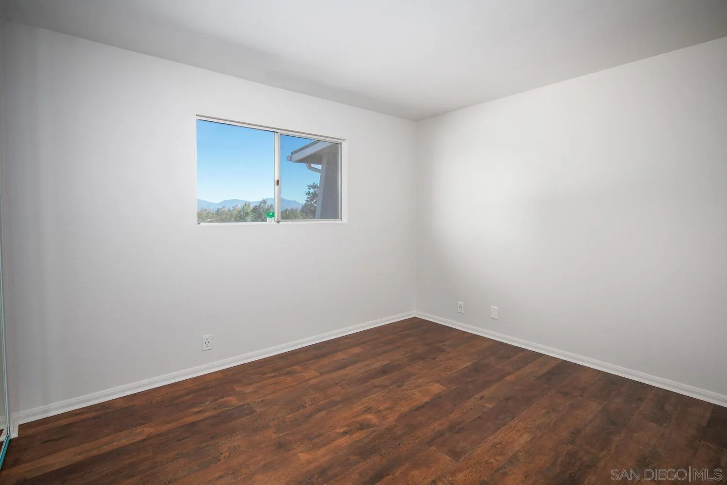 18435 Chablis Road Ramona, CA 92065 - Photo 28 of 49 a view of a small space with wooden floor and a window