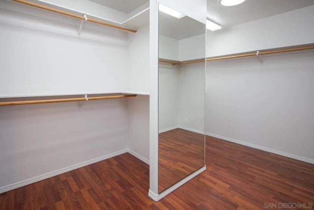 a view of an empty room with glass door