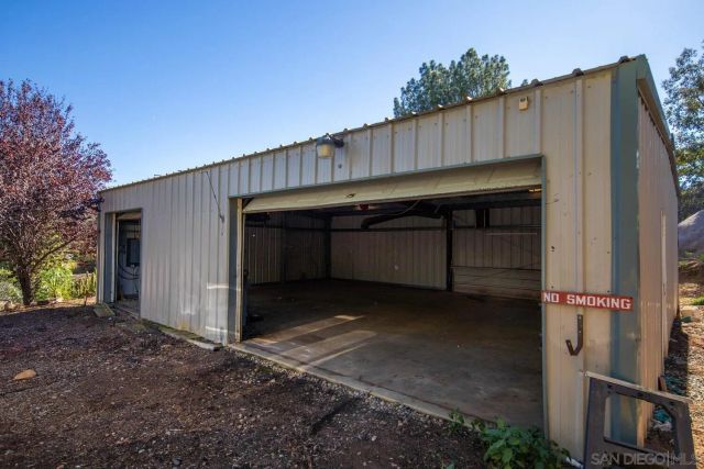 a view of a backyard with a small cabin