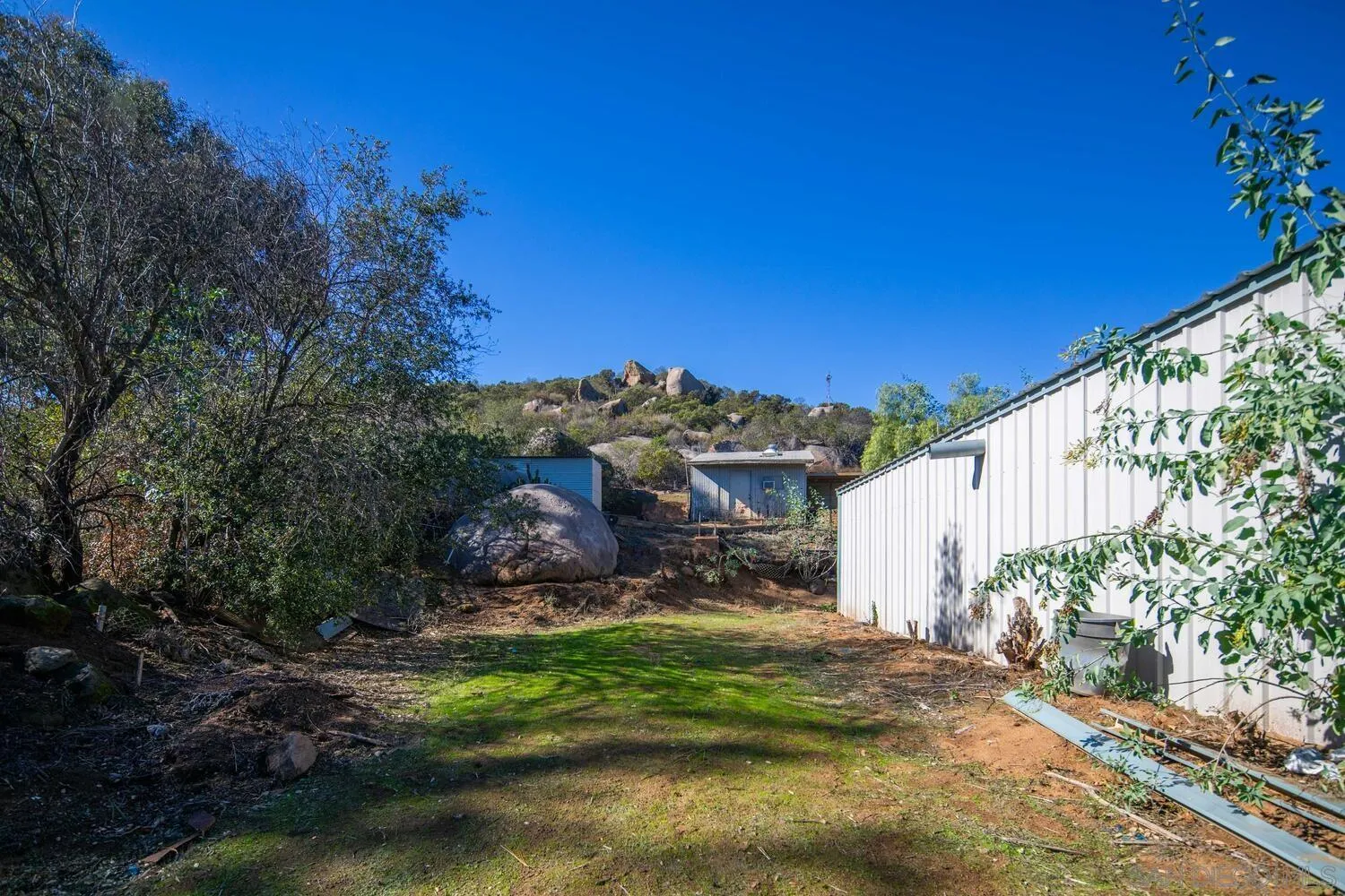 18435 Chablis Road Ramona, CA 92065 - Photo 44 of 49 a view of a house with a yard